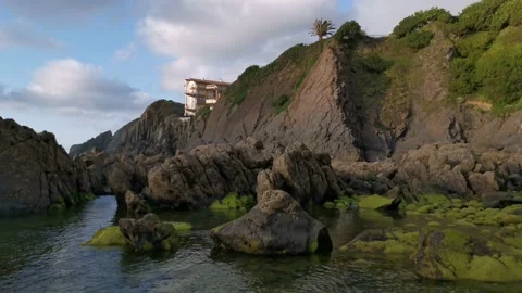 View of the green rocks and cliffs from the beach Video stock 131838072