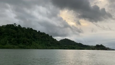 View of Green Small Island Under Cloudy Sky Stock Footage 236825853