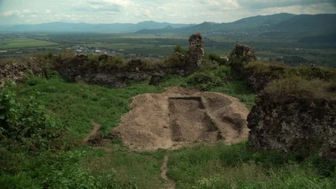 View of green valley and old Khust fortress with mountains on the background. 4k Stock Footage 114442804