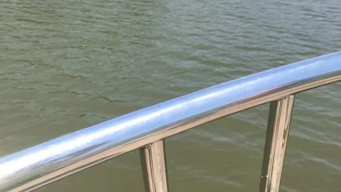 View of the green water of the river through the railing of the ship. Stock Footage 171756352