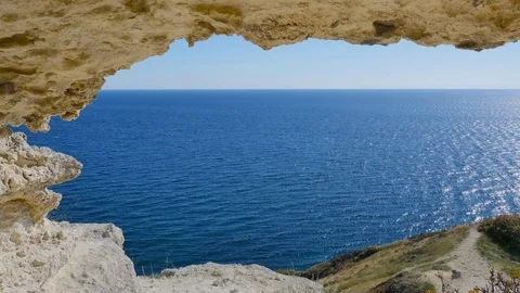 The view from the grotto to the blue sea Stock Footage 84684655