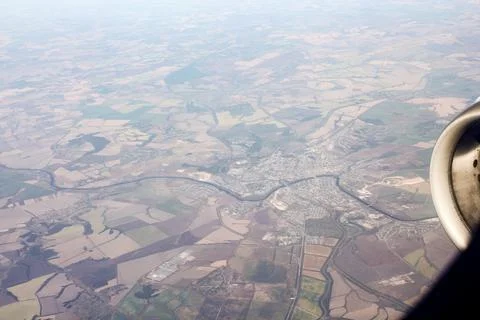 View of the ground from the airplane window. 库存照片