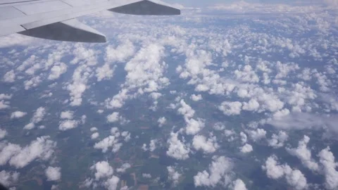 View of the ground and clouds from airplane window near Paris Stock Footage 275558653