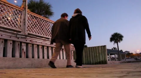View from ground of boardwalk, couple walking by Vídeos de archivo 59322471