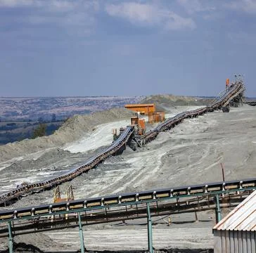View of the ground conveyor for sorting rocks and raw materials at the mining Stock Photos