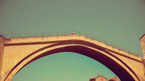 A view from ground to the famous Old Bridge in Mostar Stock Footage 140431230