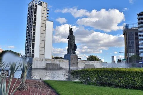 View from the ground of the Minerva statue surrounded by buildings, Guadalajara 写真素材
