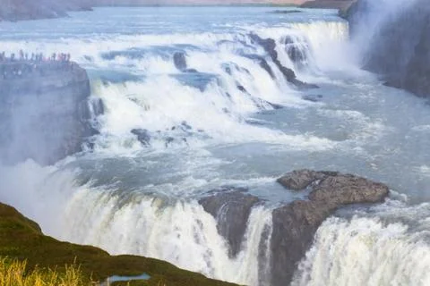 View of Gullfoss waterfall flow from canyon edge Stock Photos
