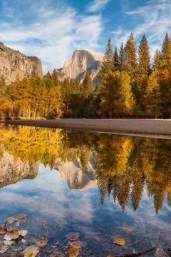 A view of half dome in Yosemite with a perfect reflection in the river Stock Photos