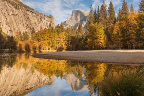 A view of half dome in Yosemite with a perfect reflection in the river Stock Photos