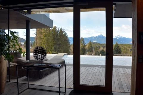 View from the hall through the transparent windows and doors of the hotel's Stock Photos