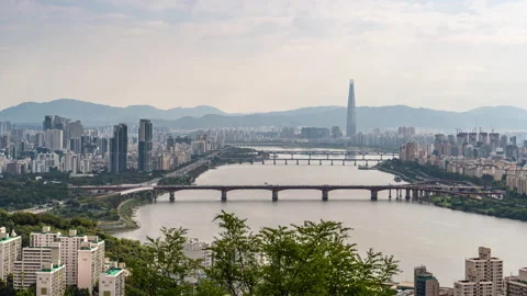View of Han river and Lotte World Tower seen on a hazy day Stock Footage 288348560