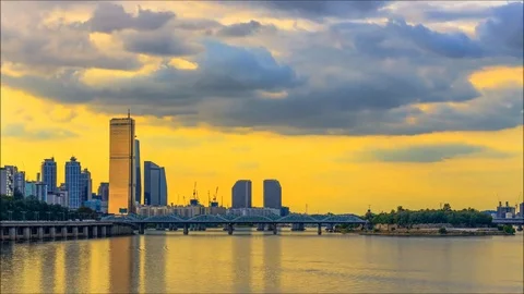 View of the Han River Sunset over the Golden Tower In Seoul, South Korea Stock Footage 81399678