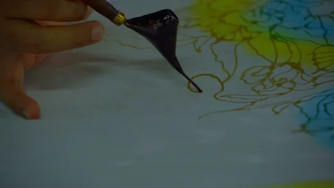 View of a hand Drawing pattern in wax prior to dyeing - Penang, Malaysia Stock Footage 108797385