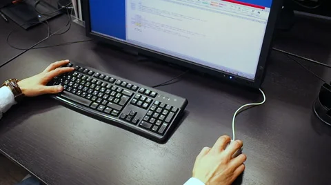  View to hand of a employee edit spreadsheet on LCD monitor Stock Footage