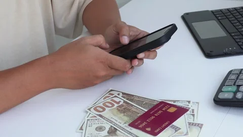 A view of a hand making a transaction with a smartphone. Stock Footage 338170075