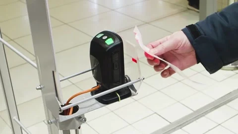 View of hand of man scanning purchase barcode on paper receipt at exit of store Stock Footage 151101088