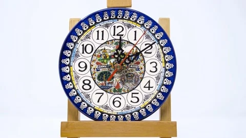 View Of An Hand Painted Ceramic Clock. Reverse Time Lapse. Stock Footage 228738695