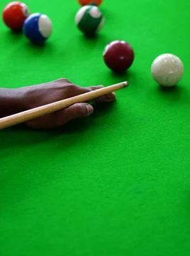 View of Hand of Player playing billiards game Stock Photos