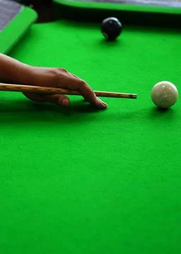 View of Hand of Player playing billiards game Stock Photos