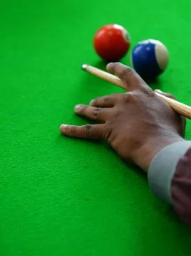 View of Hand of Player playing billiards game Stock-Fotos