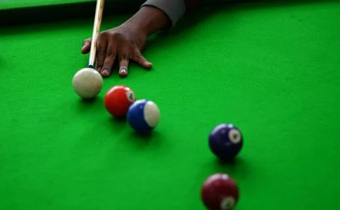 View of Hand of Player playing billiards game Stock Photos