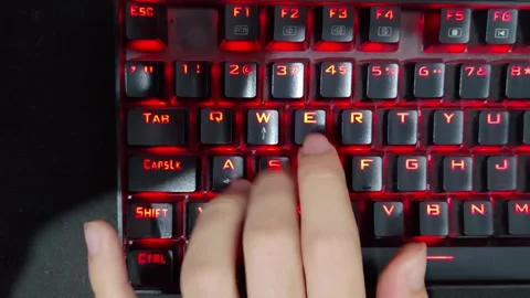 Up view of hand playing game using the keyboard keys W A S D. Stock Footage 252224332