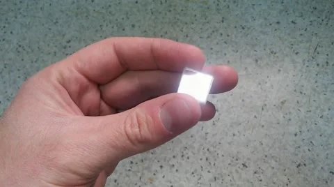 View of a hand showing a optical prism Stock Footage 56158549