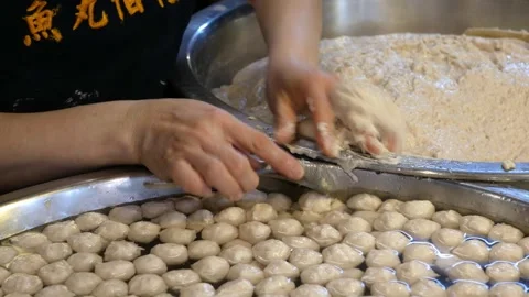 View to a hand while making fresh porkball meat ball preparing to make soup.. Stock Footage 304098000