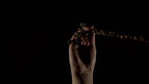 Up view of the hands holding pendulum Stock Footage 226938042