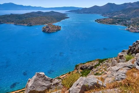 View of harbor between Spinalonga island and peninsula, known as Kalydon, and Stock Photos