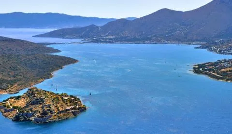 View of harbor between Spinalonga island and peninsula, known as Kalydon, and Stock Photos