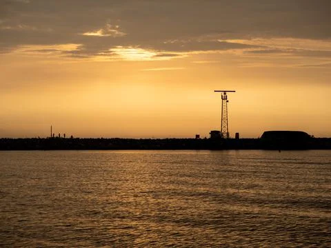 View of the harbor wall with anglers Stock-Fotos