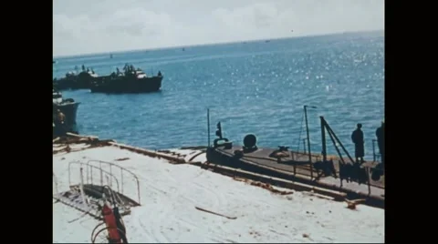View of harbour and Navy aircraft floating on ocean near Midway island Stock Footage