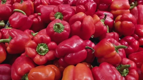 View of the harvest of large red bell pepper on the counter in the store. Stock Footage 166160275