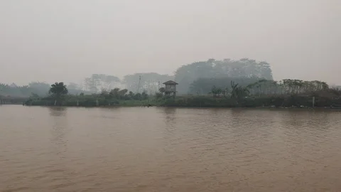 View of the haze caused by forest fires in West Kalimantan Stock Footage 344542026