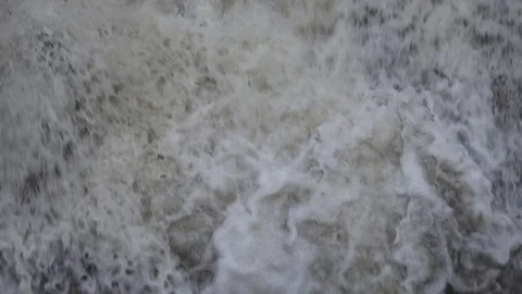 View of heavy dirty water splash cascade foam dangerous deluge after hurricane Stock Footage 81965524