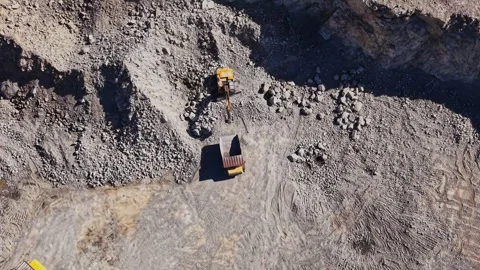 View of heavy machinery working at a construction site in a quarry Stock Footage 344539598