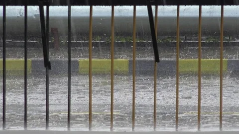 View of heavy rain fall on asphalt dangerous hurricane rainfalls with ice ball Stock Footage 81965733