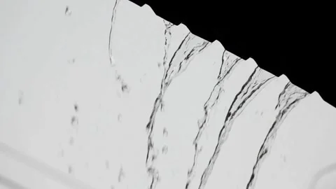 View of heavy rain water flowing down from the roof in rainy season. 4K HD 스톡 동영상 336571402