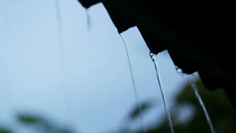View of heavy rain water flowing down from the roof in rainy season. 4K HD Stock Footage 336571469