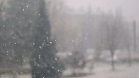 View of heavy snowfall during daytime through the window Stock Footage 122202946
