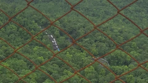 View of heavy traffic moving along a winding mountain road. Stock Footage 342047518