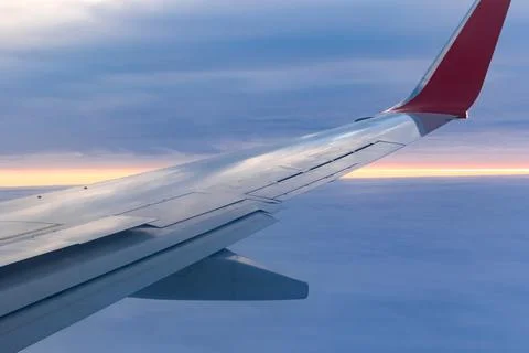 A view from a height above the clouds from the plane's window. part of an air Stock Photos