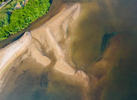 A view from a height of a beach waves breaking on a sandy beach Stock Photos