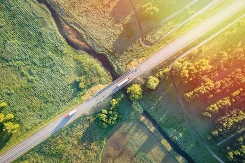View from height of beautiful fields with green grass at dawn in morning from Stock Photos