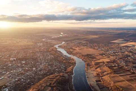 View from a height of a blue winding river stretching into the distance. Autu Foto stock