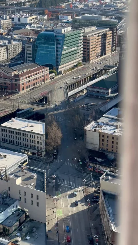 View from a height of the city road passing cars bright light day Stock Footage 241030723