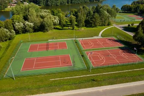 View from the height of the empty Tennis courts in the daytime in summer Stock Photos