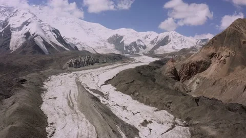 View from the height of glaciers, snow-capped mountains, colorful rocks Stock-Footage 210186951